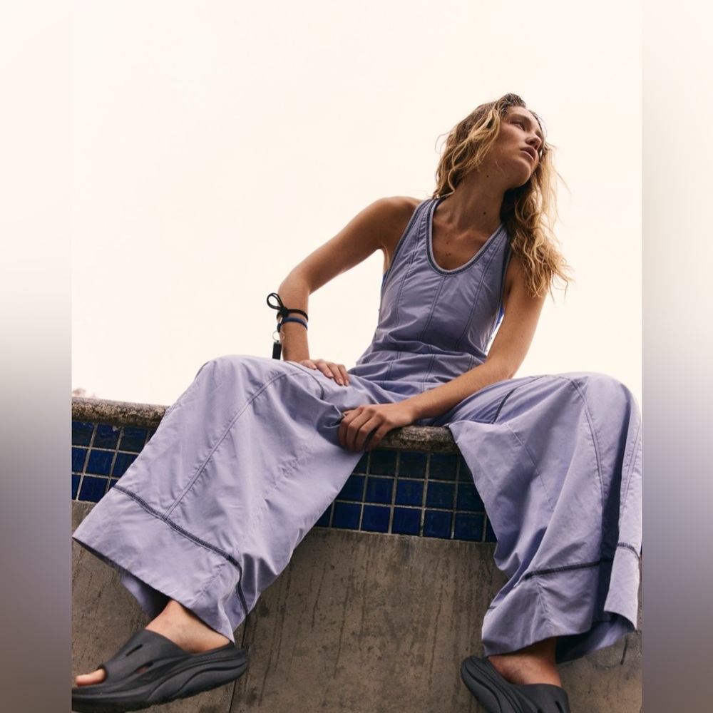 Free people movement wild ambition jumpsuit in platinum.